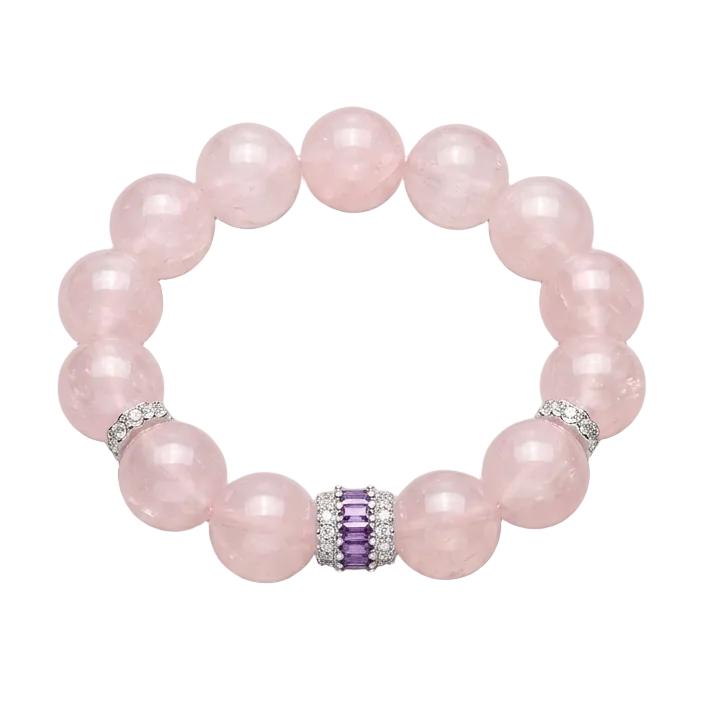 Pink beaded bracelet with a purple gemstone bead on a gray background