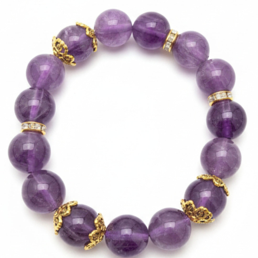 Purple beaded bracelet with gold accents on a white background
