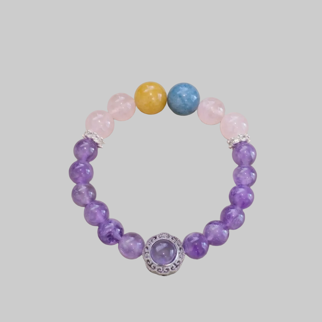Multicolored beaded bracelet on a light gray background