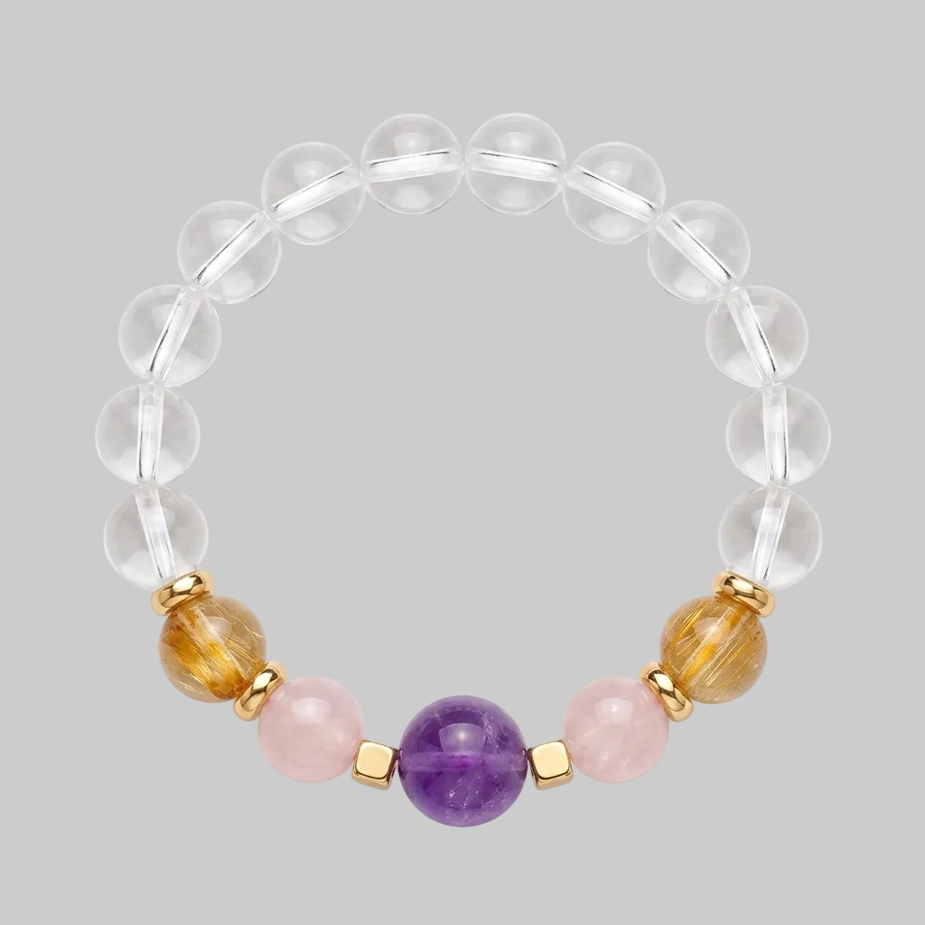Clear quartz gemstone bead bracelet with amethyst, rose quartz and rutilated citrine centrepiece beads and gold-plated spacers